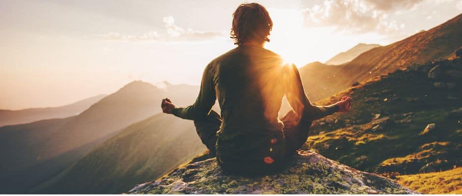 man relaxing in the mountains